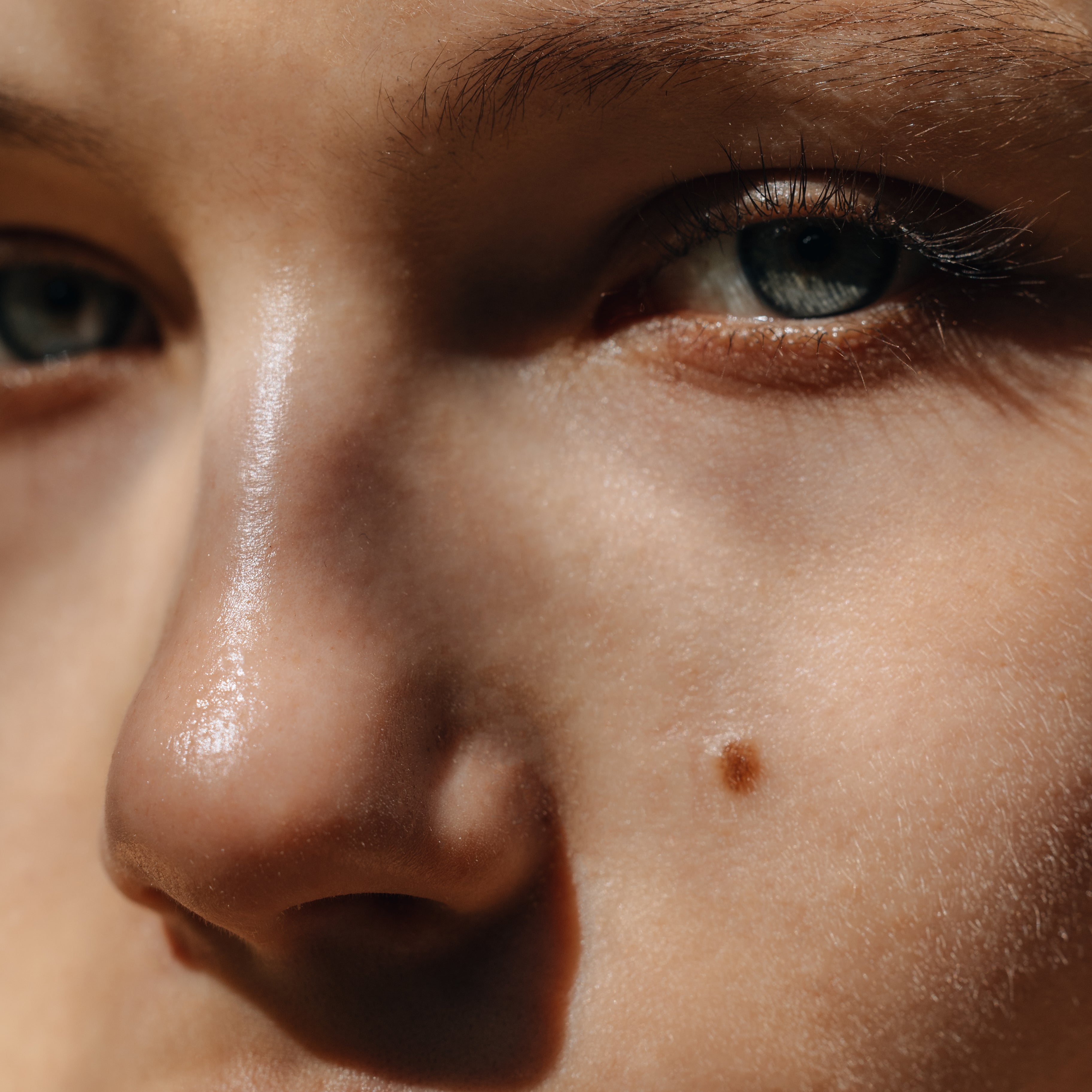 Closeup image of woman with light blue eyes and fair skin