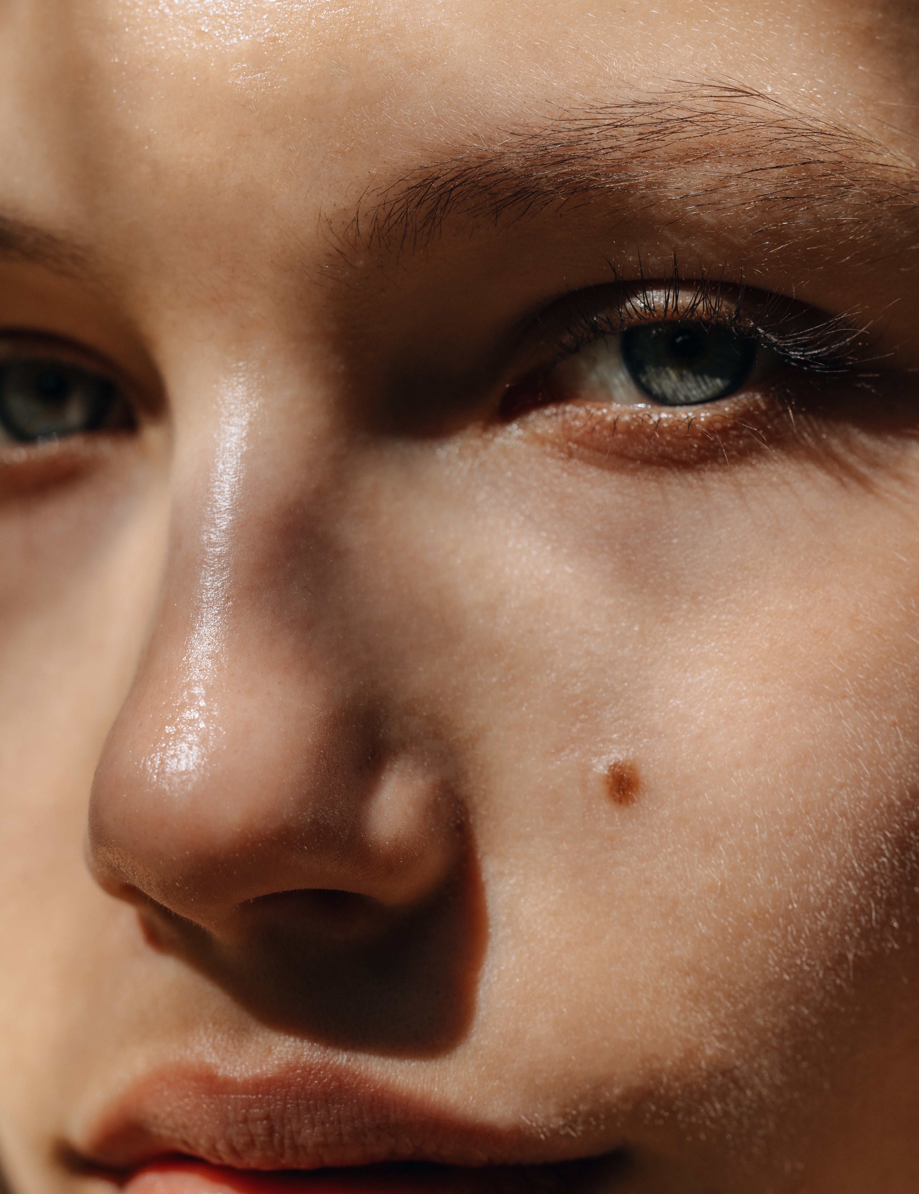 Closeup image of woman with light blue eyes and fair skin
